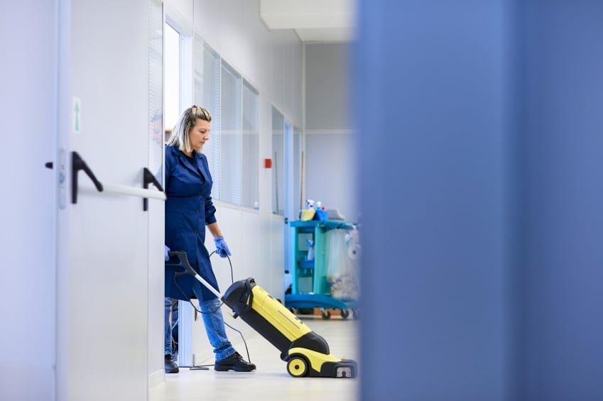 female-staff-vacuum-building-cleaning