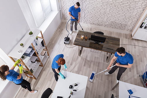 Four Employees Cleaning A Commercial Property